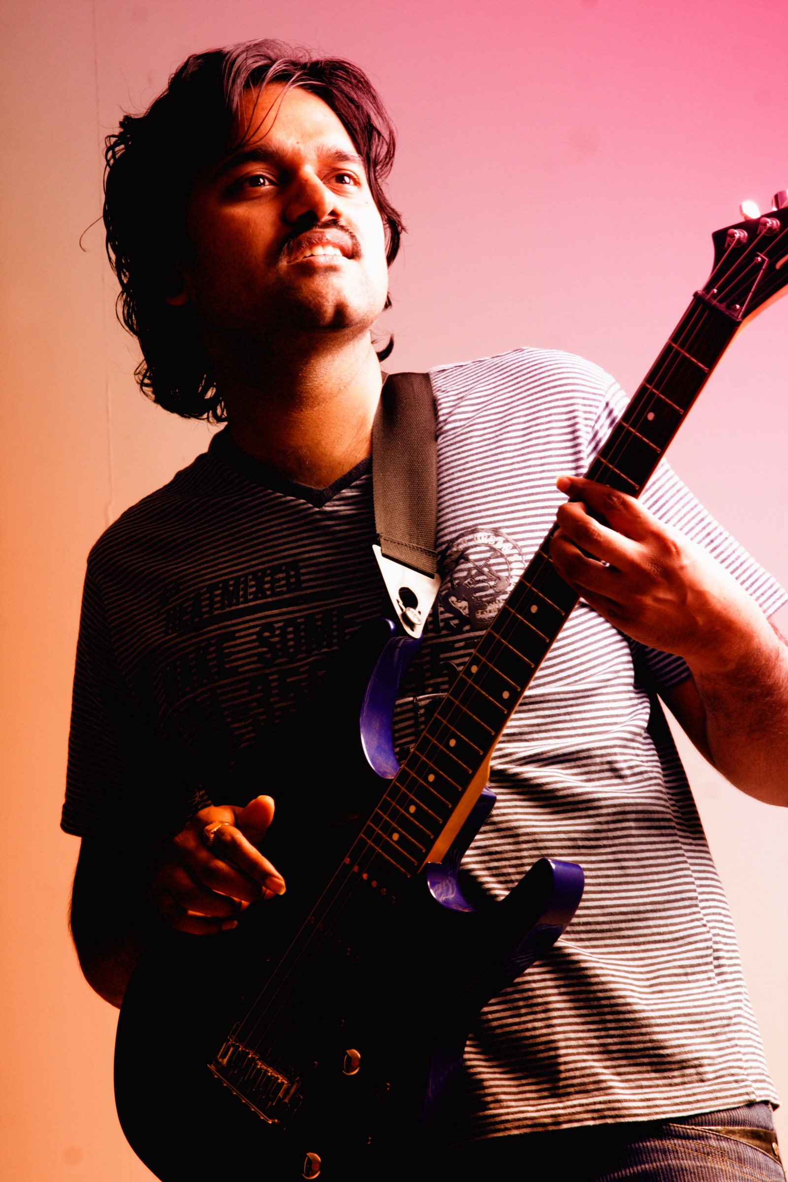 PC Shivan playing electric guitar